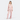 Woman wearing a patterned pajama set on a white background
